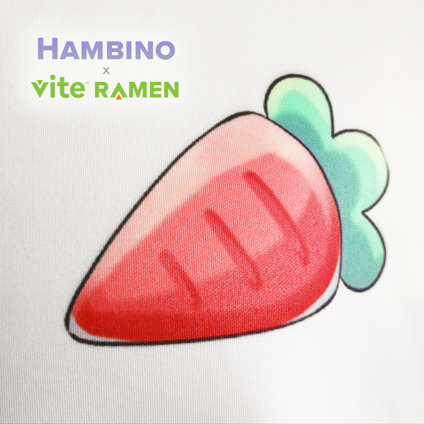 A closeup view of the cartoon carrot on the front of the Hambino x Vite Ramen hoodie